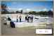 Show image 'Shareholders view the installation of the first floor panels.' in New Window