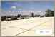 Show image 'A view of the nearby cement factory taken from the eastern side of the roof.' in New Window